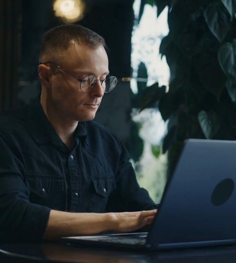 Photo of a man on the computer